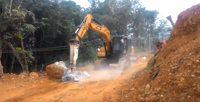 SANY 13.5 ton small excavator SY135C breaks the ground for a road construction project