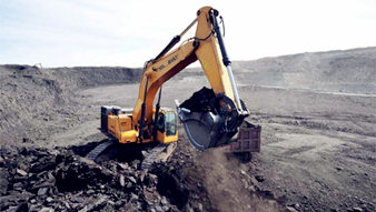 BUILD WITH POWER: SY215C EXCAVATOR USED IN TRENCHING WORK