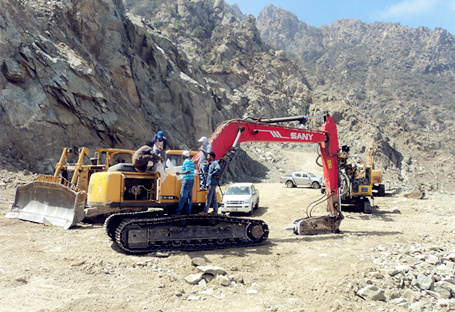 SANY medium excavator SY215C used in a winding road construction project